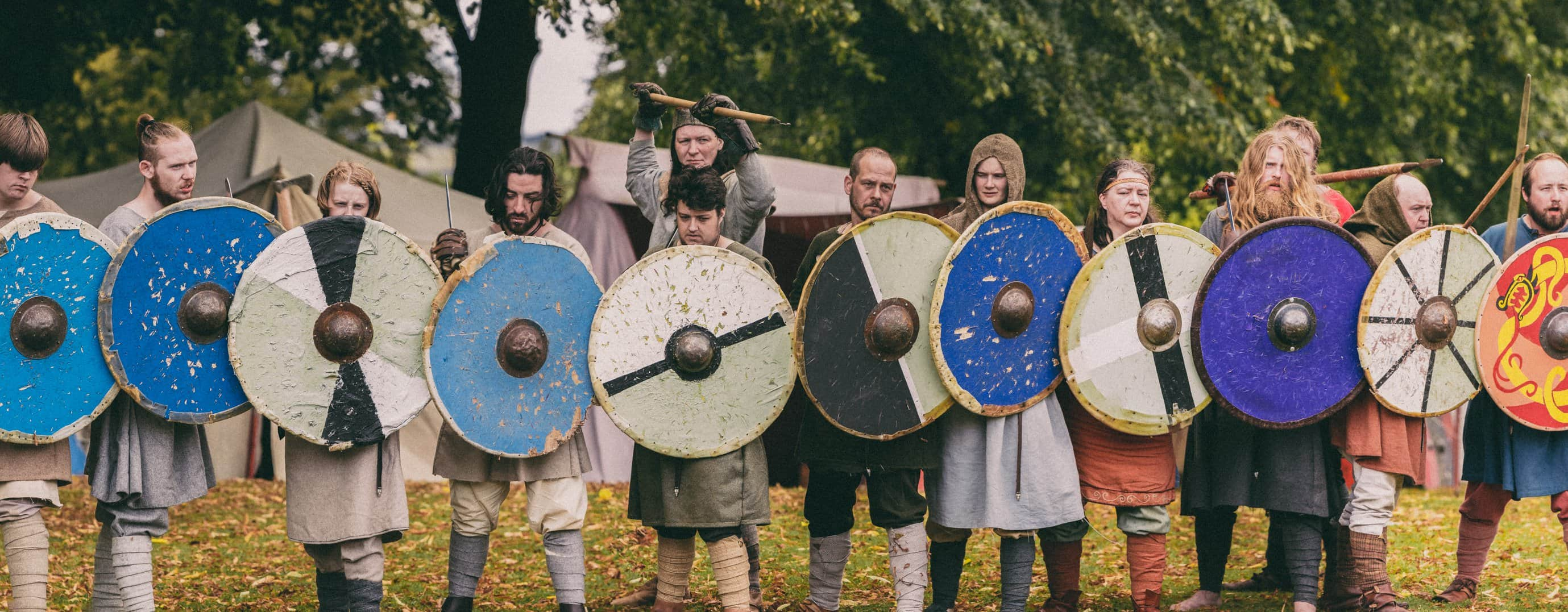 The image shows peasants in a shield wall waiting for the Vikinhg onslaught